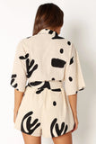 Kellie Romper Beige Black